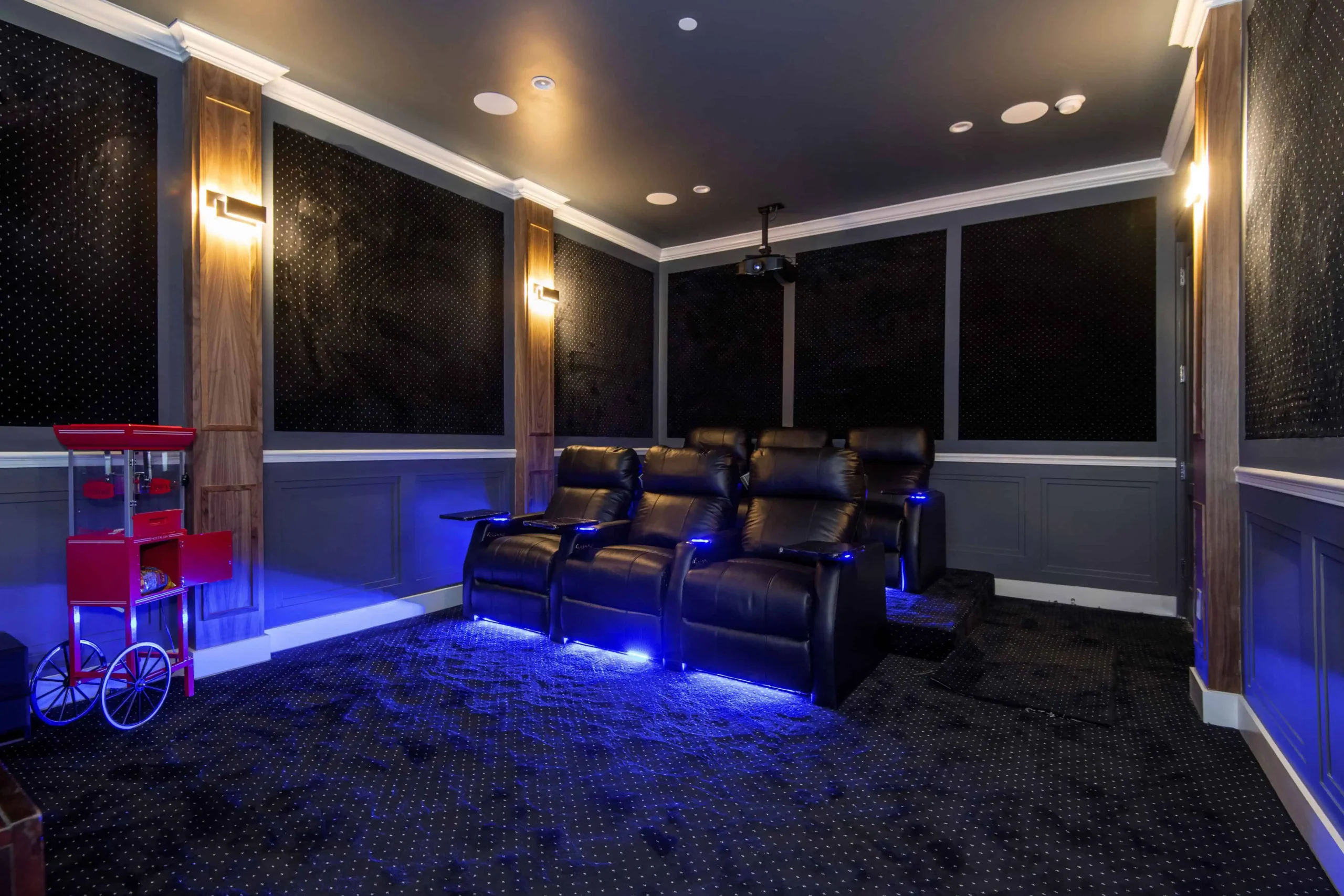 A Blue Lit Home Theater With A Black Leather Sofa 2024 05 10 17 52 26 Utc